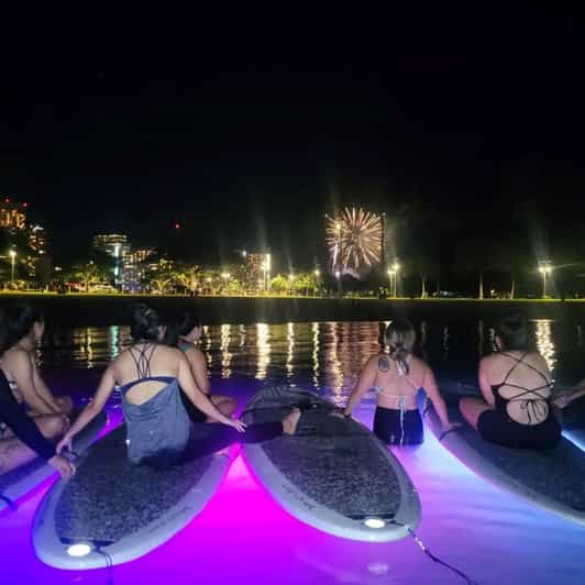 Honolulu: Fireworks Glow and Flow Yoga Class - LED-lit SUP boards: what the glow adds, and what to watch for
