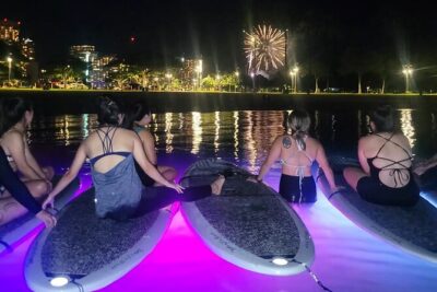 Night SUP Yoga and Fireworks at Magic Island - The LED-lit SUP yoga flow: from standing poses to float meditation