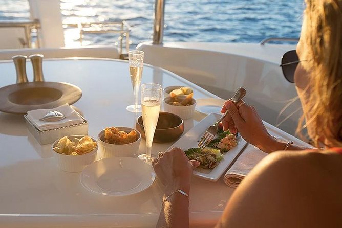 Private Oahu Sunset Charter with Tasting and Drinks - The Sunset Channel anchor stop and the Pacific foot-dip moment