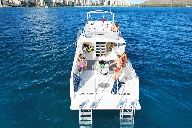 Small group Turtle Snorkel (16 people max): Sightings Guaranteed - Snorkeling setup: gear, flotation vest, and two guides in the water